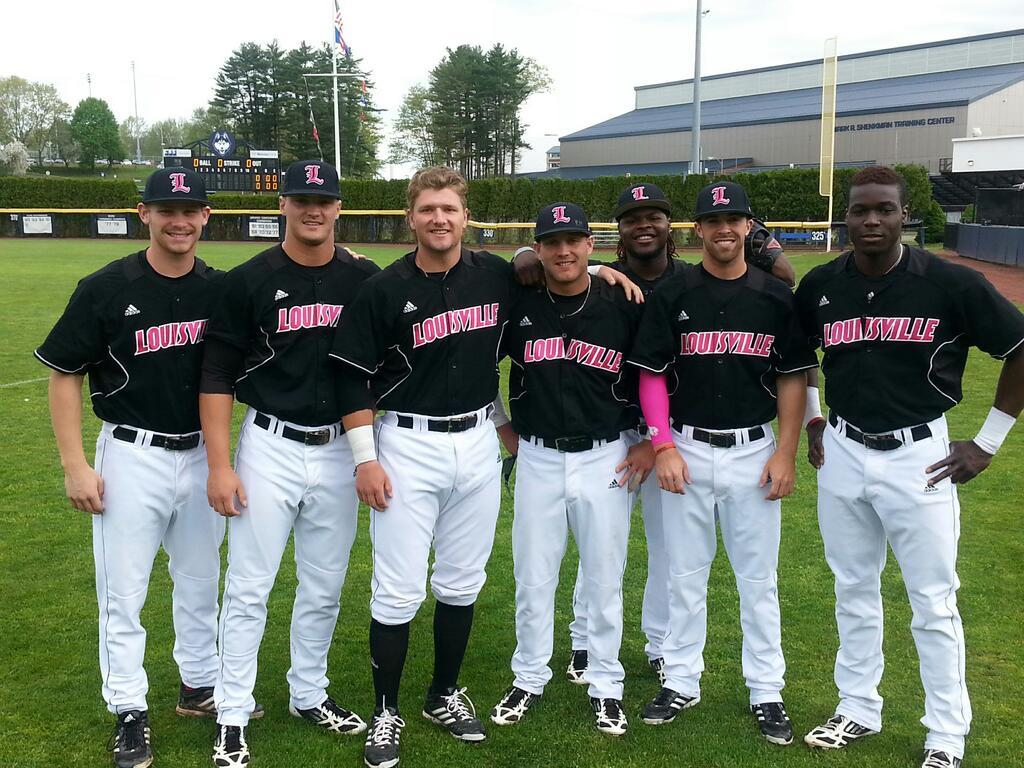 Louisville wearing pink baseball uniforms and hats today in